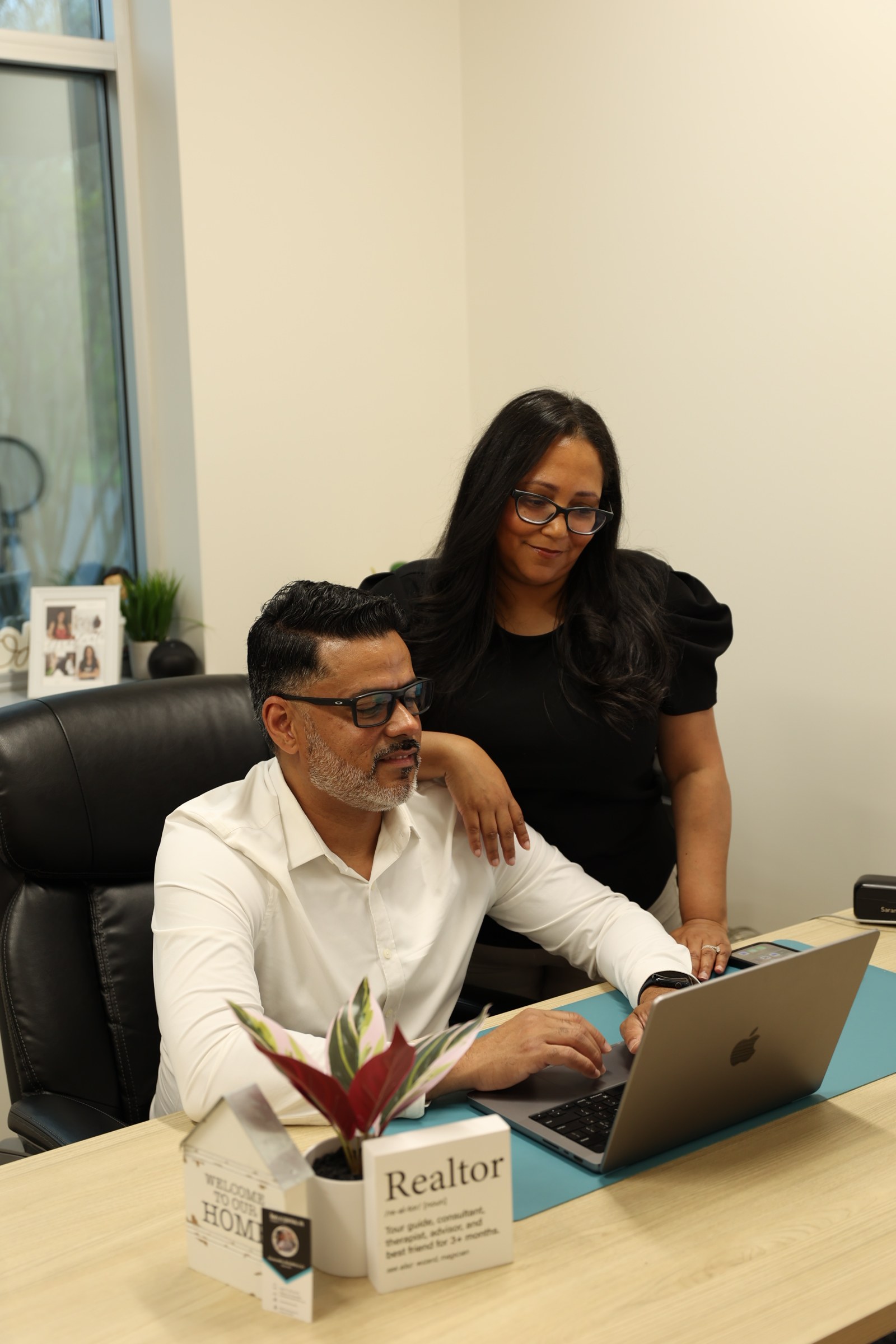 Damaris Rodriguez and her team reviewing listings together
